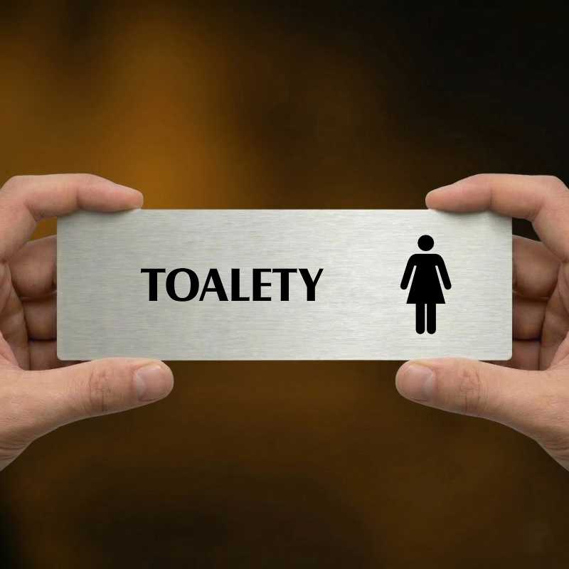 Toalety ženy, 240x79mm, stříbrná popiska