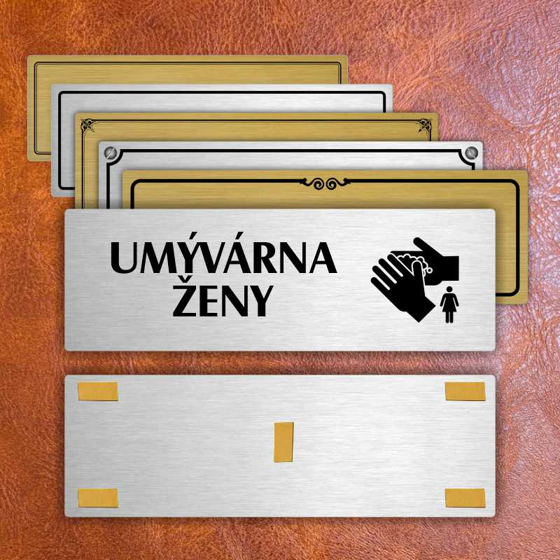 Umývárna ženy, 240x79mm, stříbrná popiska s ozdobou uprostřed