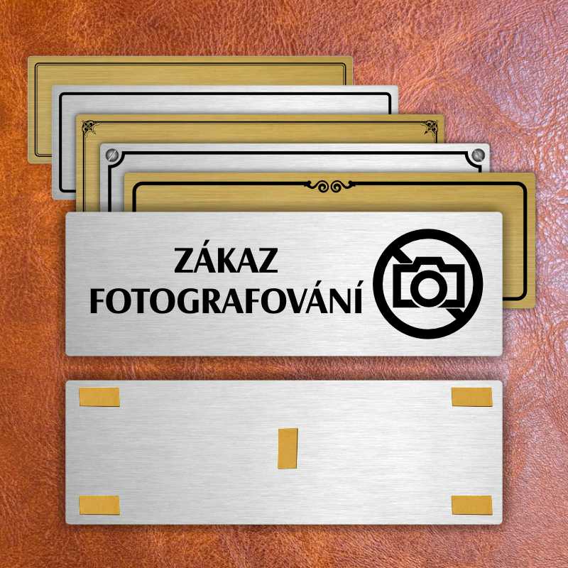 Zákaz fotografování, 200x66mm, stříbrná popiska s ozdobou uprostřed