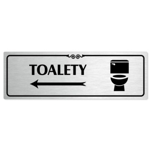 Toalety vlevo, 240x79mm, stříbrná popiska s ozdobou uprostřed