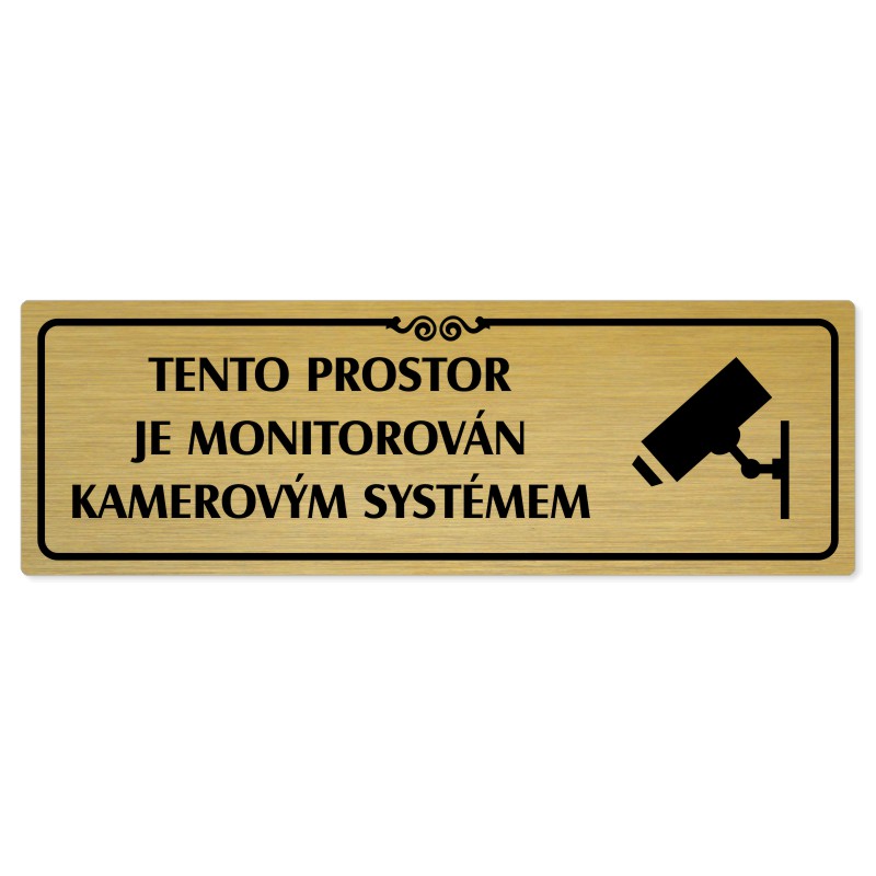 Kamera, 200x66mm, zlatá popiska s ozdobou uprostřed