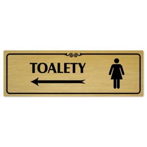 Toalety vlevo ženy, 240x79mm, zlatá popiska s ozdobou uprostřed